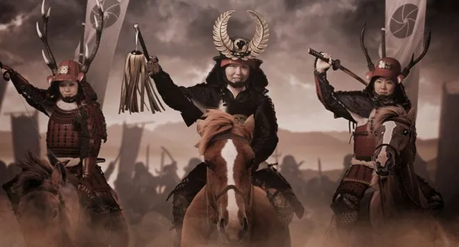 Guests posing as samurai warriors in full armor on horseback