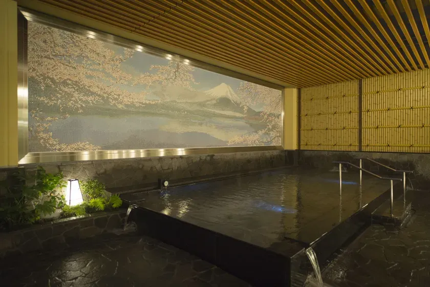 Indoor hot spring bath with Mt. Fuji mural at Thermae-Yu